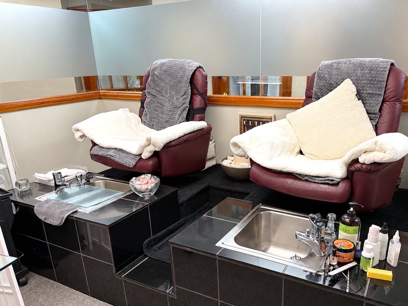 Pedicure room with two plush pedicure chairs and sinks at Springs Spa & Salon in Colorado Springs
